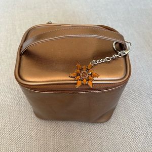Bath & BodyWorks bronze make up bag